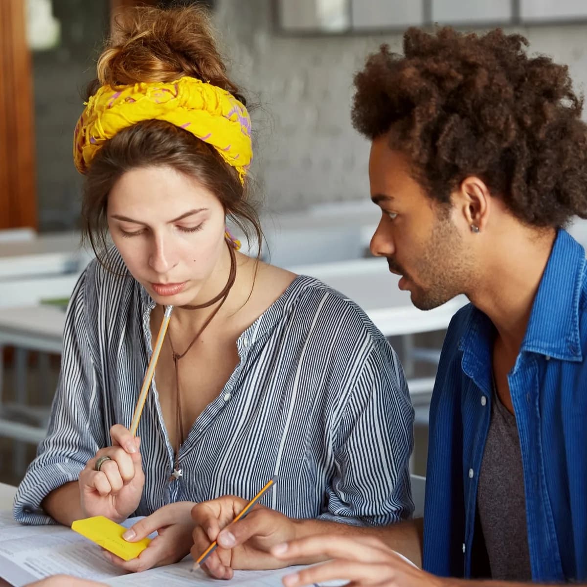 Two students working on a thesis together